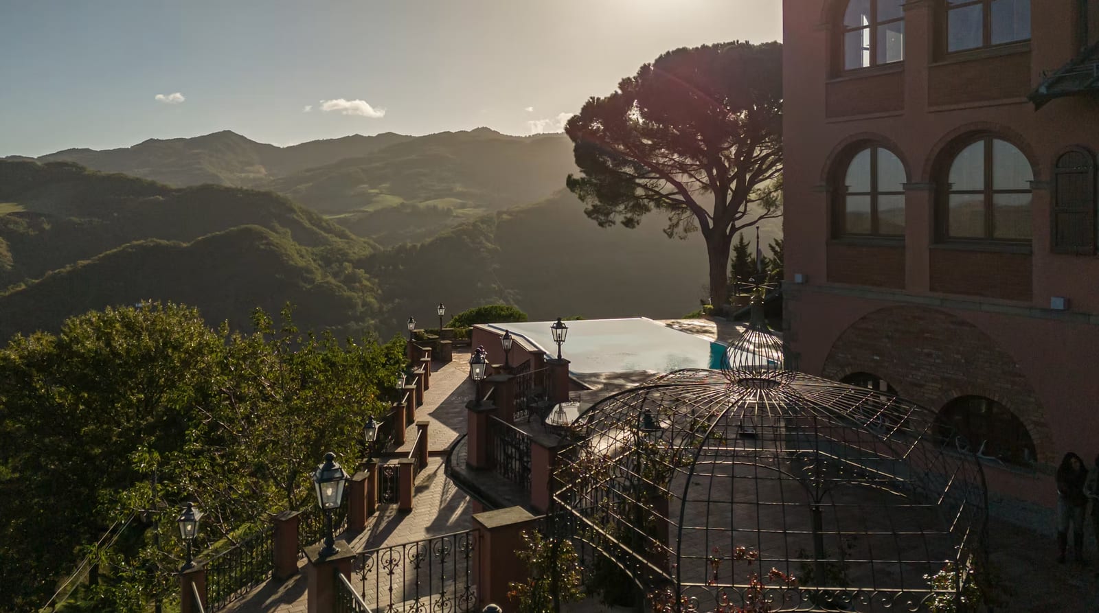 The terrace and infinity pool at Castello Alidosi, looking over the Apennine hills